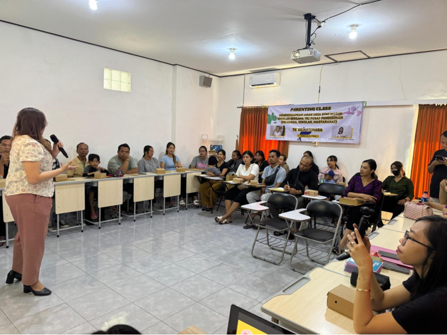 Denpasar – The School Environment Introduction Program (MPLS) at TK Sila Kumara for the 2024-2025 academic year was carried out with an innovative approach through a Parenting Class event themed "Preparing for School with the Tri Education Center." This event was attended by the parents of new students joining the small kindergarten class. (19/7/2024) The Parenting Class aimed to help parents understand the importance of the initial adjustment period when children first enter school. During the session, the Psychology team from Universitas Pendidikan Nasional (Undiknas) invited parents to discuss their crucial role in supporting their children psychologically during this transition. Parents were also provided with guidelines on how to apply parenting practices that can assist their children in adapting to their new school environment. The three main objectives of the event were: Helping parents understand the importance of the adjustment period for children when they first enter school. Providing guidance on how to support children psychologically during this adjustment process. Building strong cooperation between parents and the school in creating a supportive environment for the children’s well-being. The Undiknas Psychology team facilitated discussions and brainstorming sessions with parents regarding behaviors and parenting patterns that could be implemented to help children adapt to the new school environment. This approach is expected to foster synergy between the school and parents, which will positively impact the development and readiness of the children as they progress to higher levels of education. This event aligns with the Sustainable Development Goals (SDGs), particularly Goal 4, which aims to ensure inclusive and equitable quality education and promote lifelong learning opportunities for all. It also emphasizes the importance of access to quality early childhood development, so that children are ready to enter primary education with optimal preparation. Through this Parenting Class, Undiknas Psychology hopes to make a significant contribution in supporting quality early childhood education, as well as strengthening collaboration between parents and schools to enhance the well-being of children in the future.